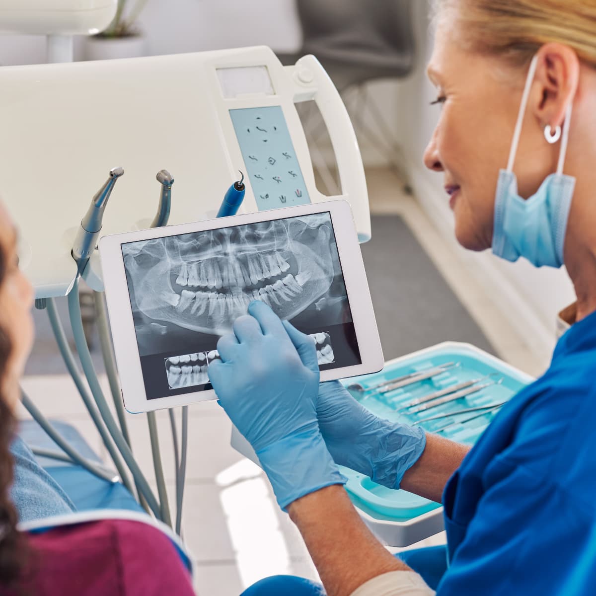 dentist reviewing x-rays with a patient