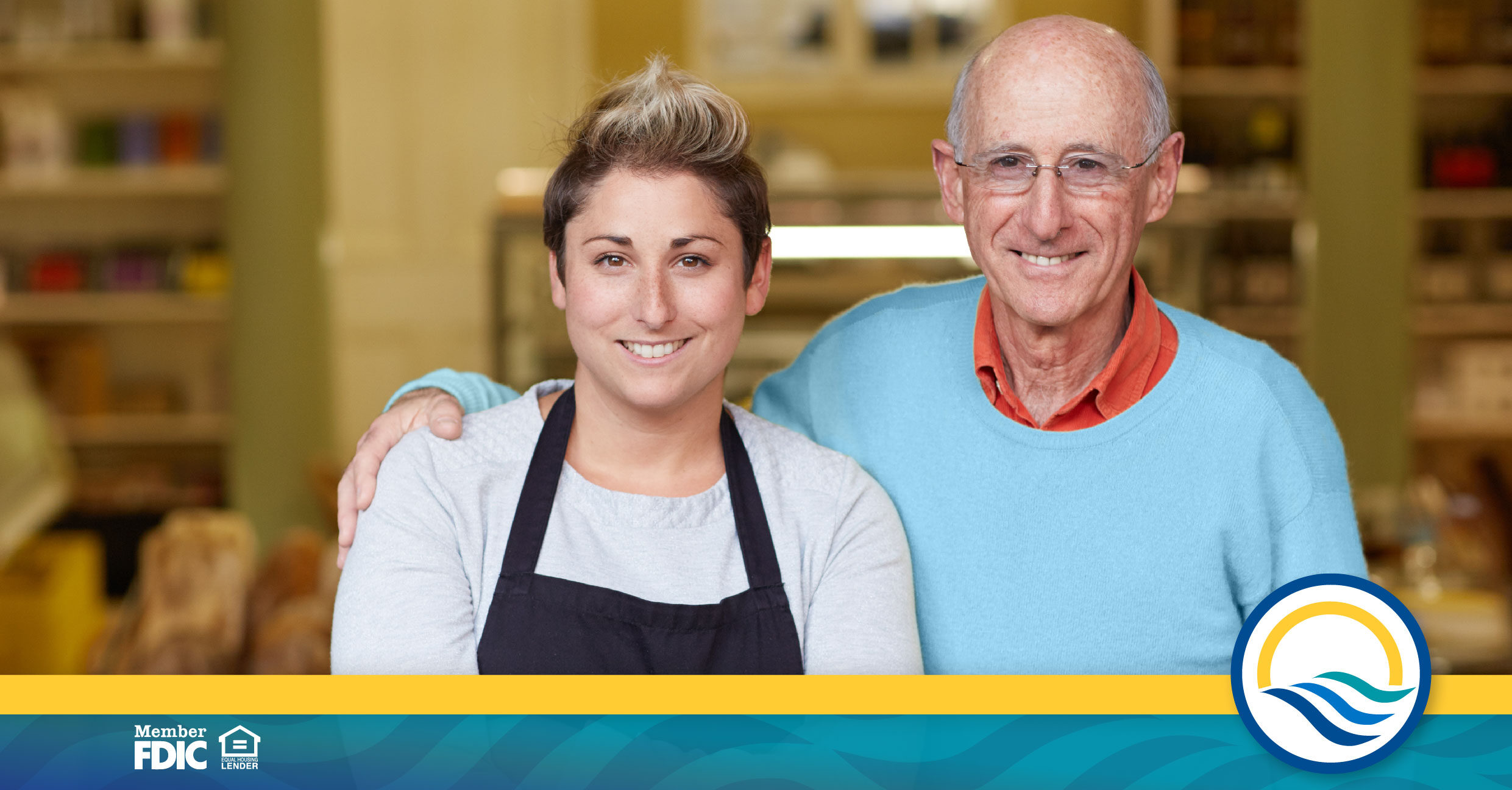 Older man and younger woman stand together 